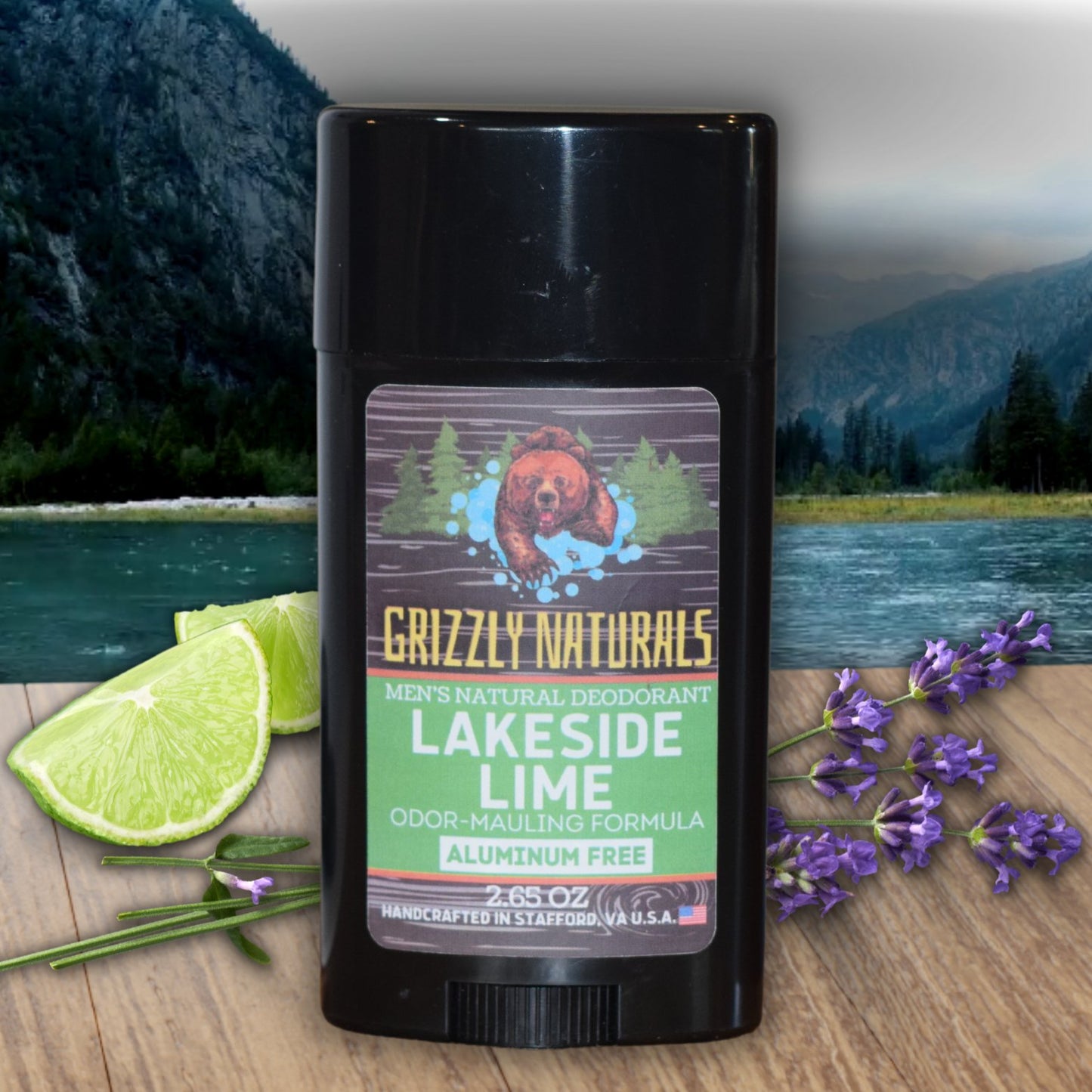 Grizzly Naturals Lakeside Lime deodorant photographed outdoors near a serene lake with fresh limes and herbs, capturing its refreshing, clean scent.